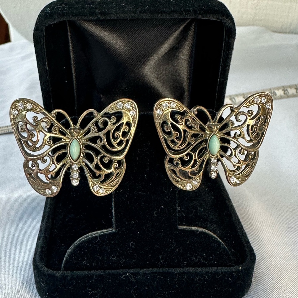 Open scrollwork butterfly and rhinestone earrings
